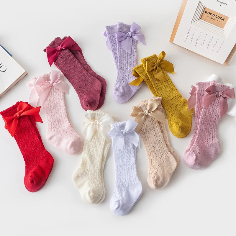 Ewapi lace knit baby socks with satin bow accents, soft and delicate footwear for infants in 0-12 months.